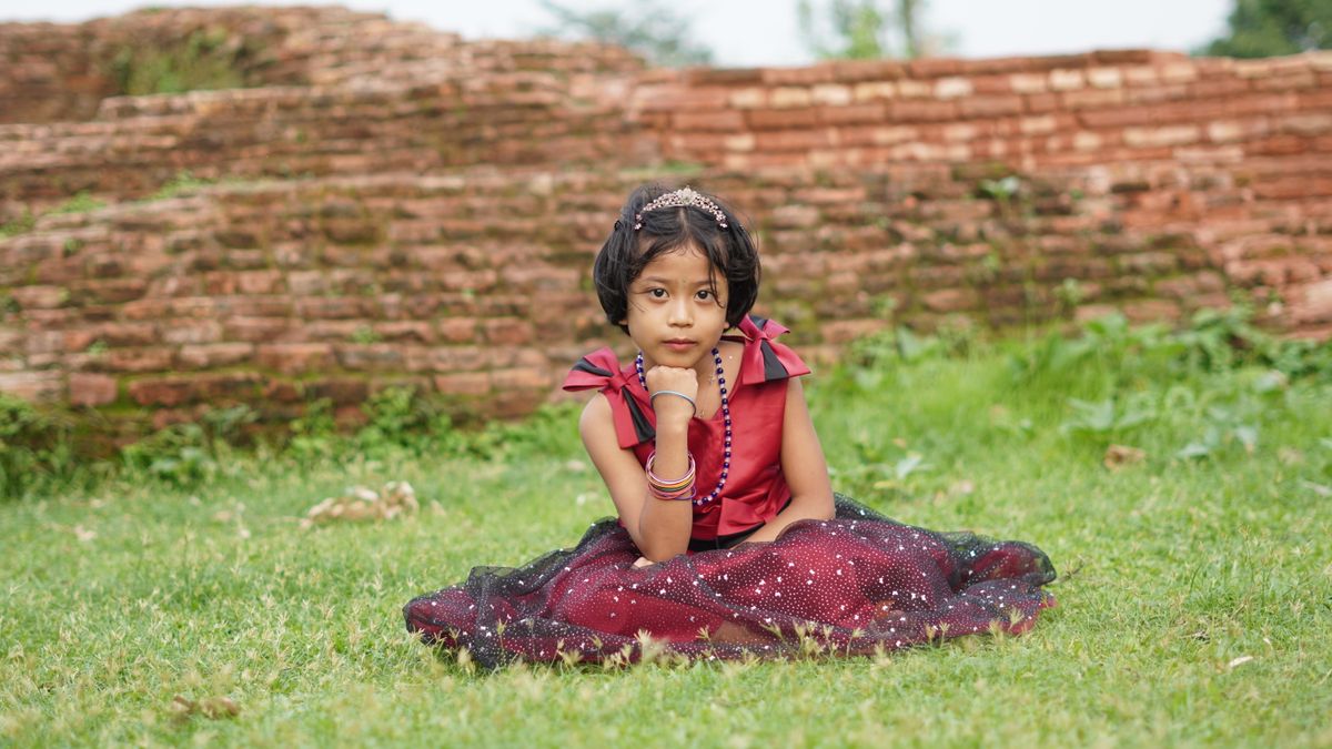 Portrait of a Young Girl in Traditional Dress Outdoors · Free Stock Photo