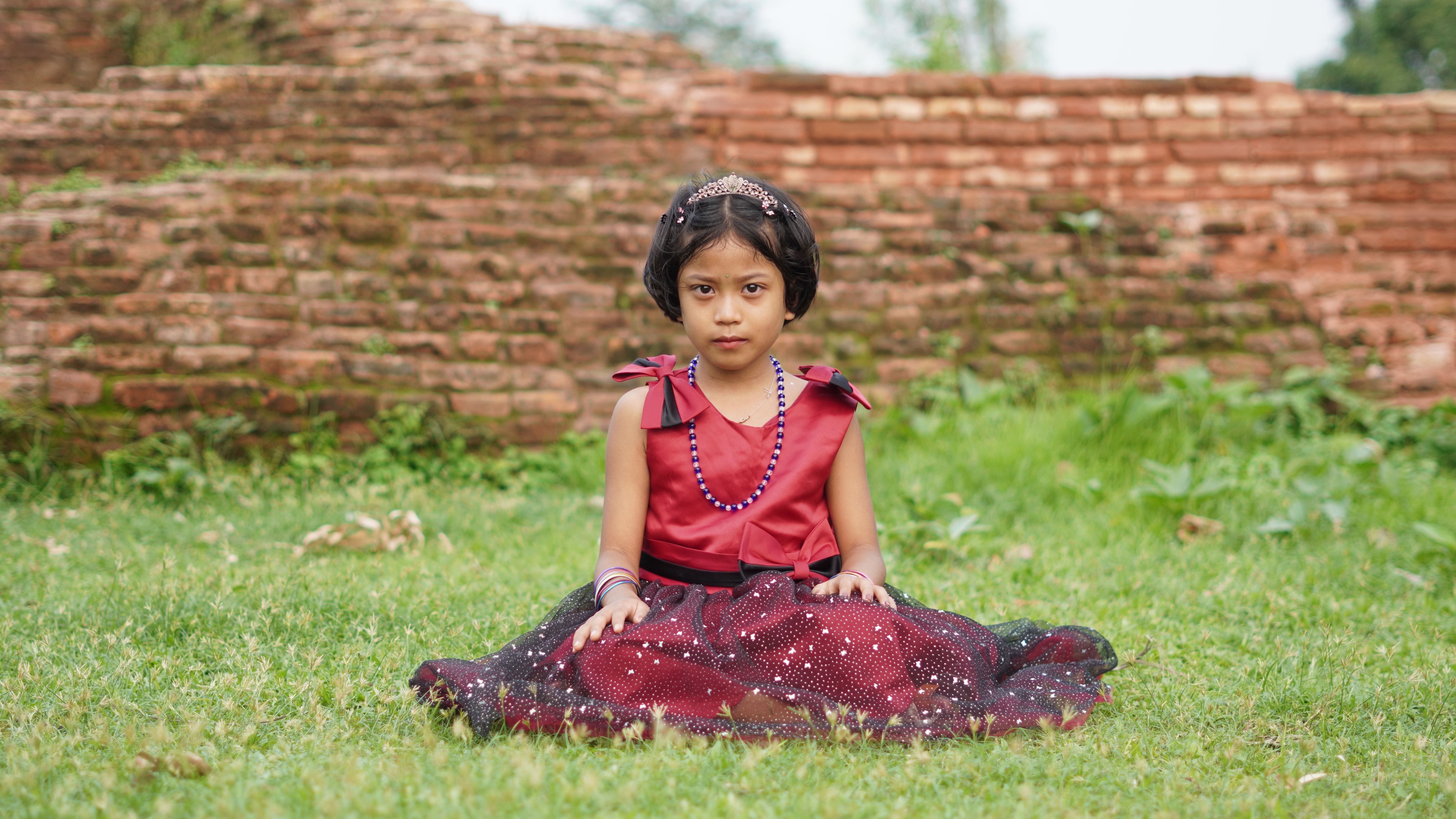 Young Girl in Elegant Red Dress Outdoors · Free Stock Photo