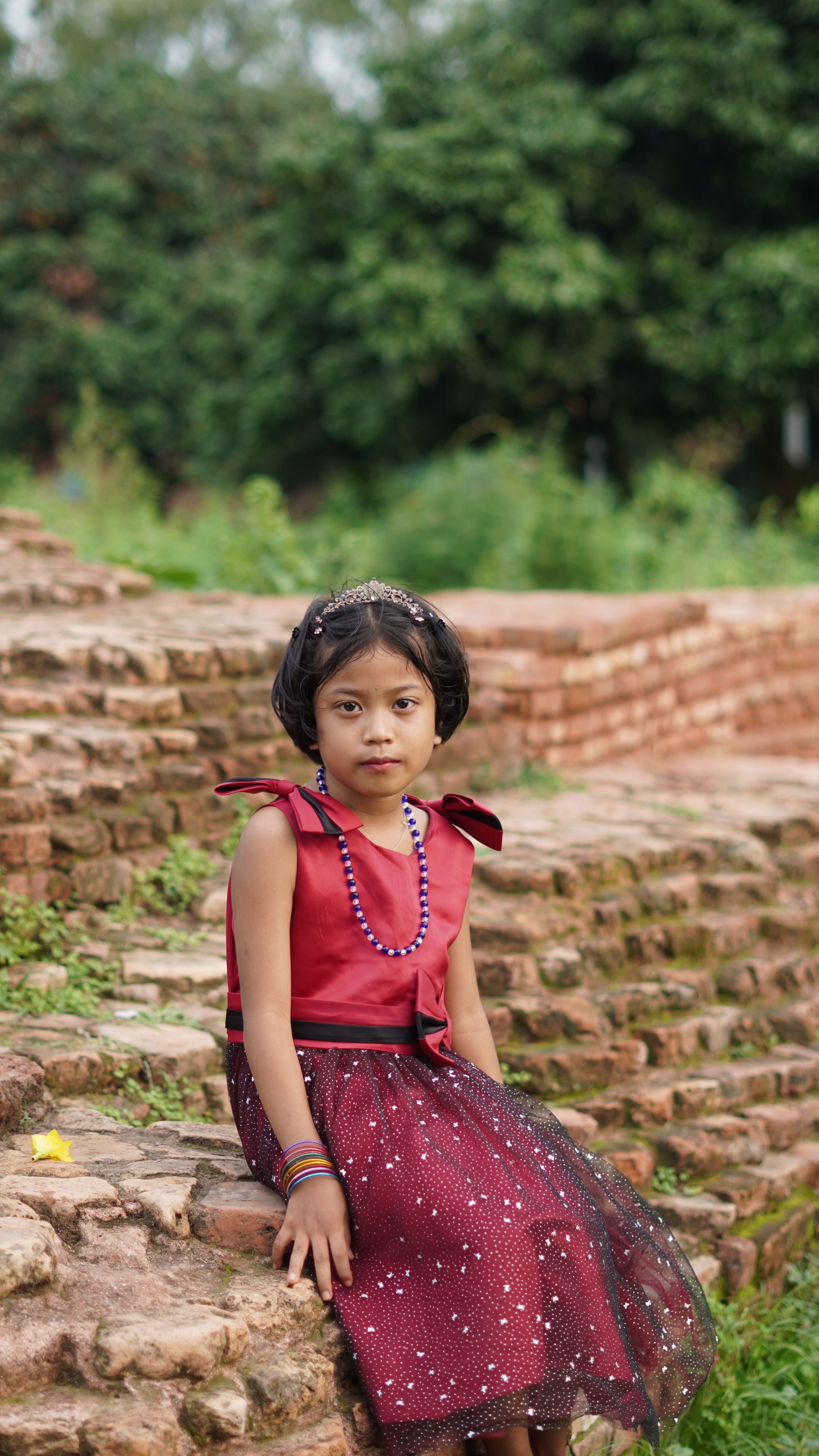 Portrait of a Young Girl in Traditional Dress Outdoors · Free Stock Photo