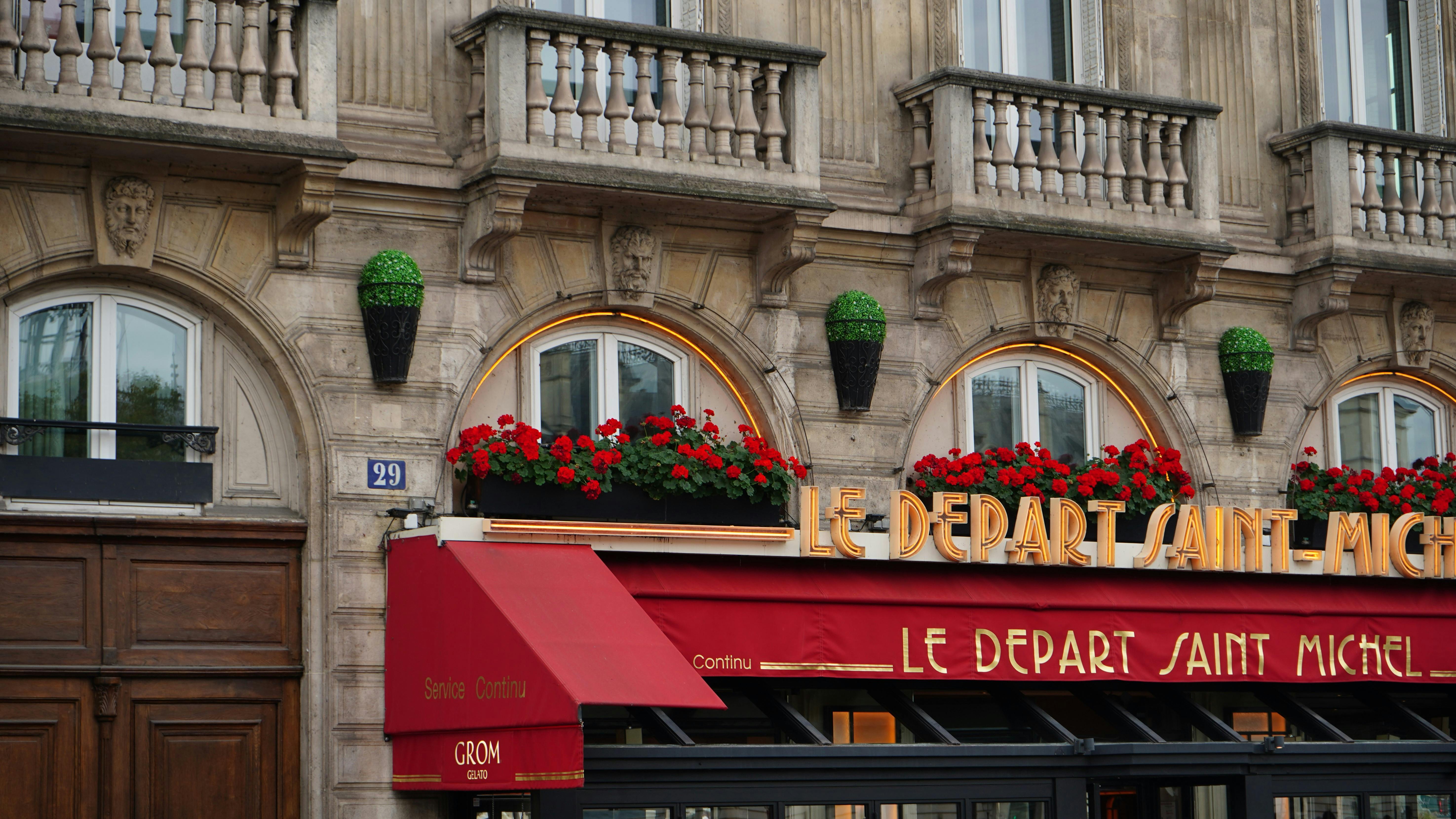 charming parisian cafe facade with red awning
