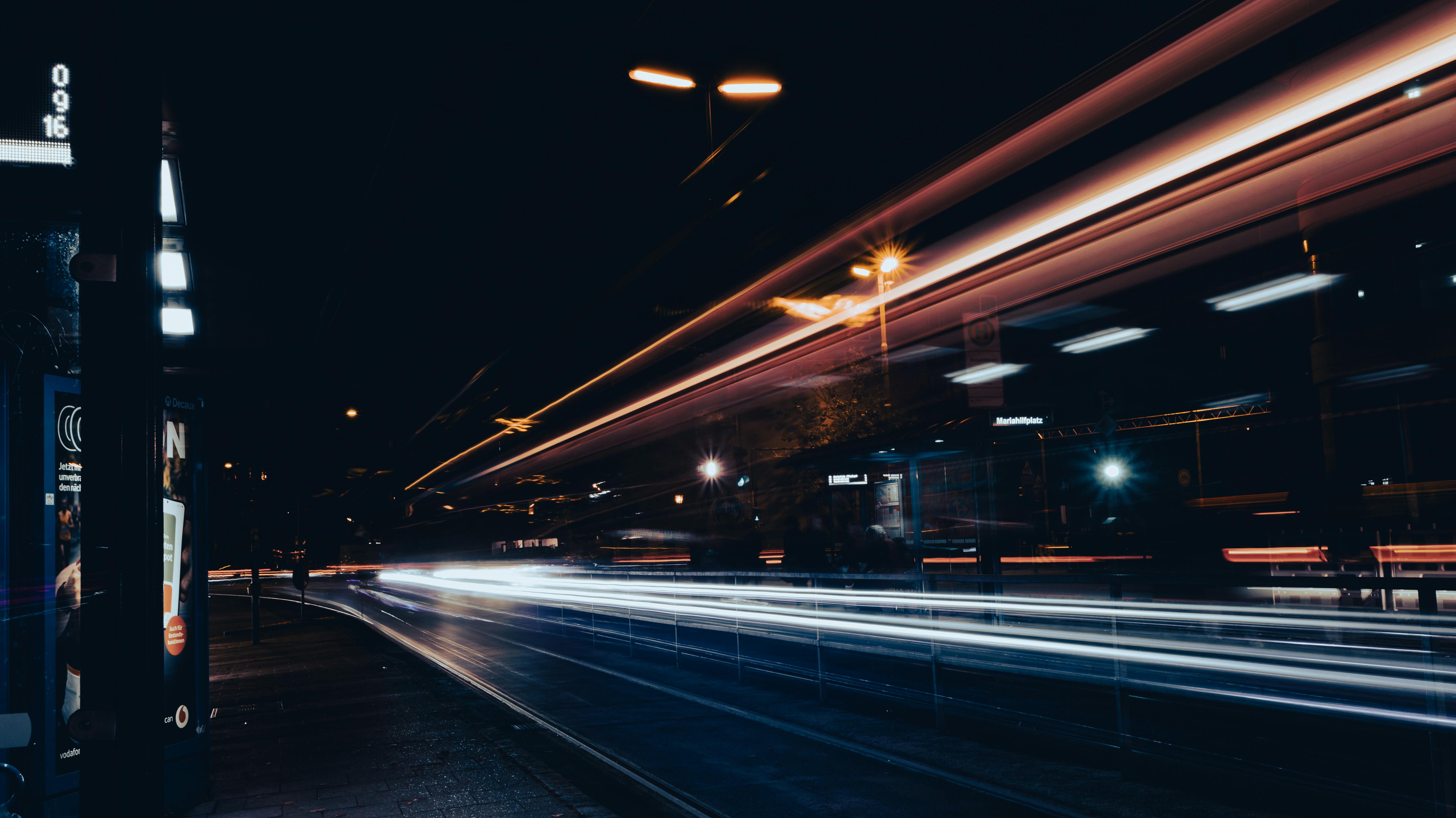 Long exposure capture of vibrant night traffic lights in München, illustrating urban energy.