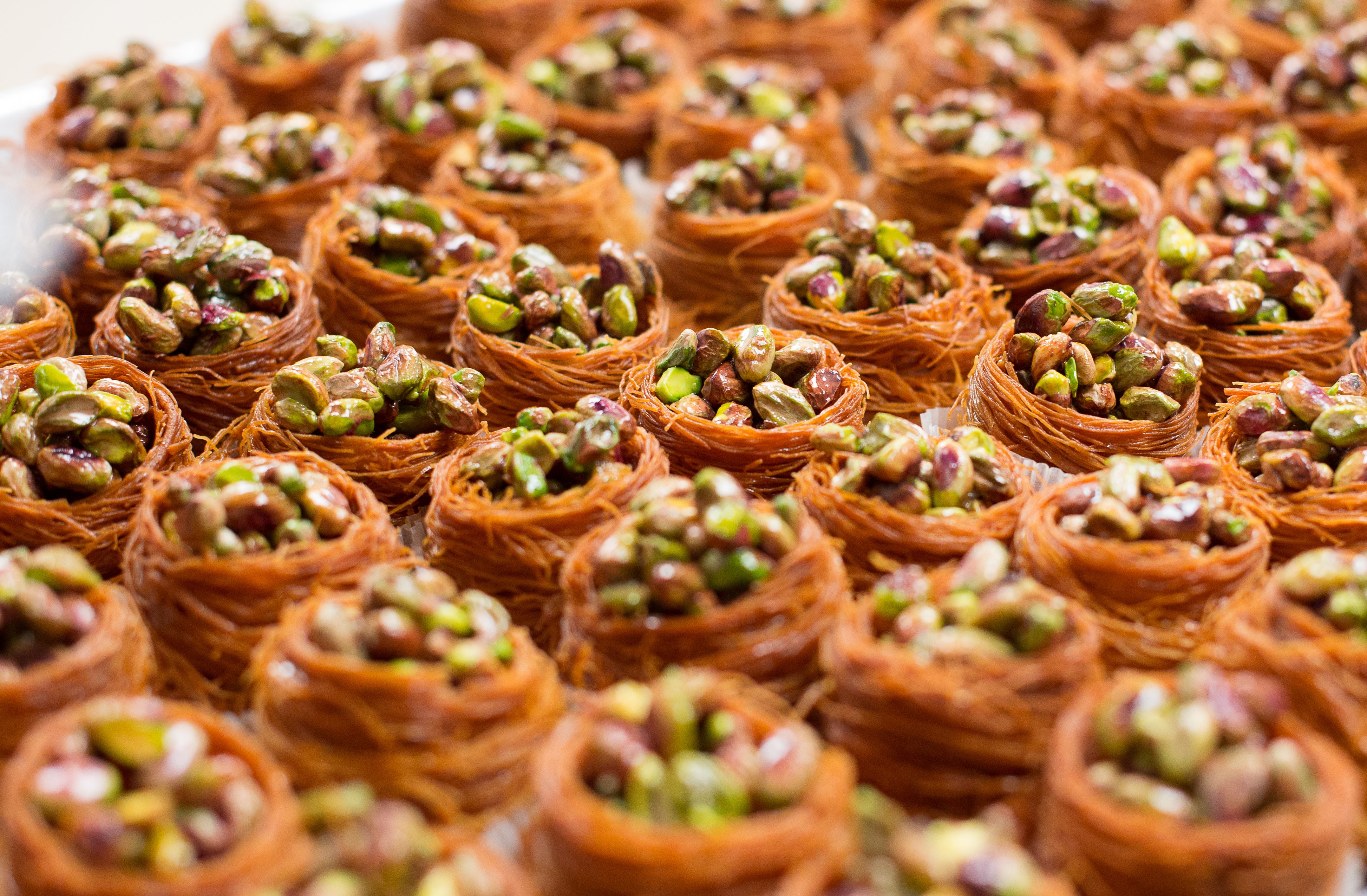 Free Close-up of delicious baklava nests filled with pistachios, showcasing a sweet dessert treat. Stock Photo