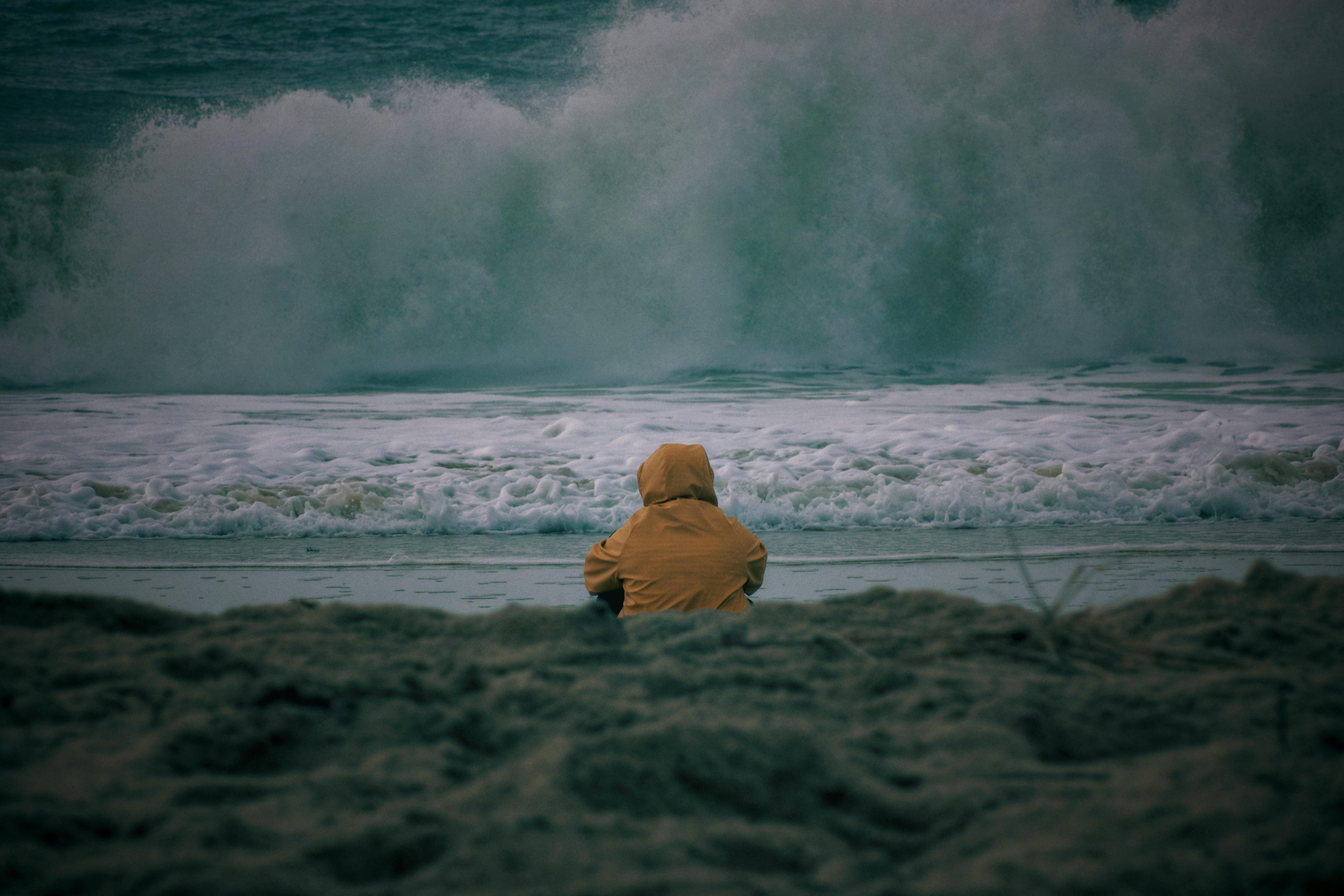 solitary figure on a stormy french beach