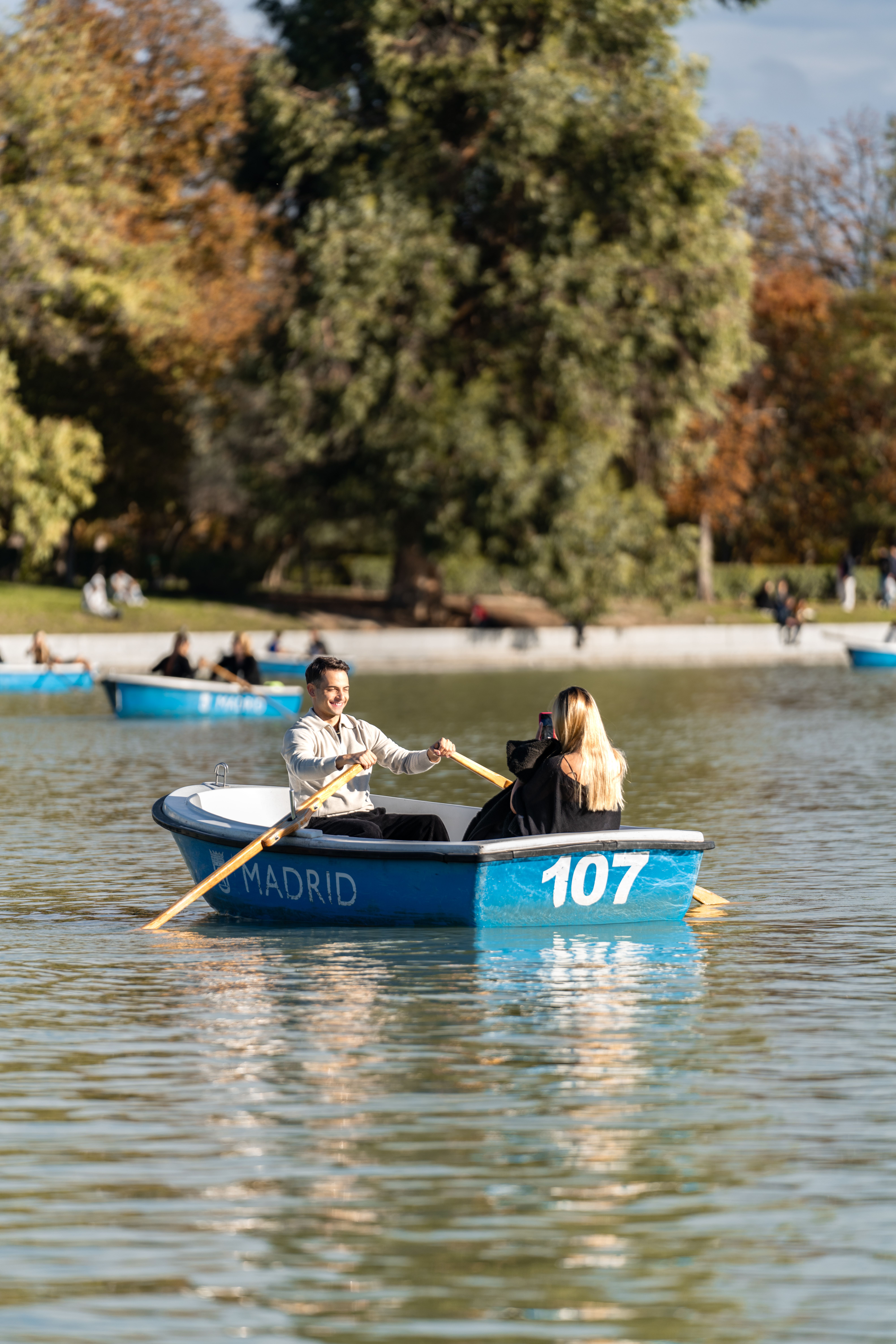 Couple Enjoying Rowboat Ride in Madrid Park · Free Stock Photo