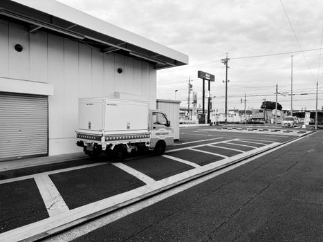 Monochrome image of an industrial street and small truck in Toyohashi, Japan.