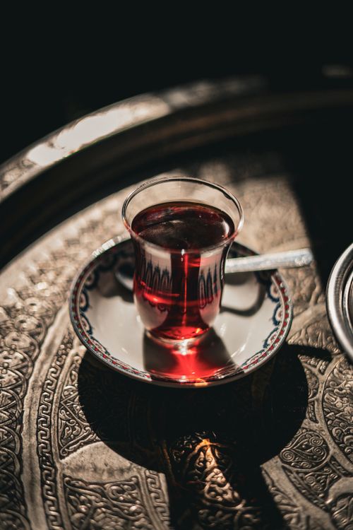 Free Experience the ambiance with a classic Turkish tea served in a traditional glass teacup in Istanbul, Türkiye. Stock Photo