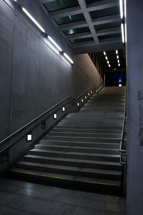 Free A moody, dramatic view of a modern subway staircase in Budapest, Hungary. Stock Photo