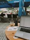 Laptop and Coffee at Outdoor Cafe Workspace