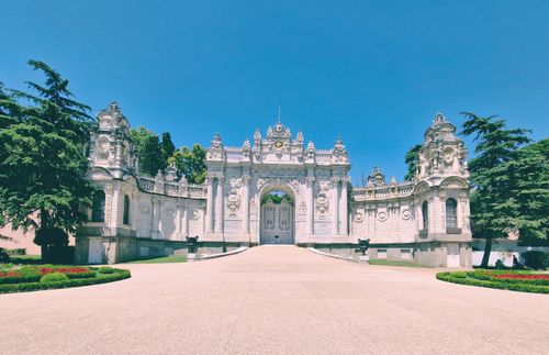 Free Stunning view of Dolmabahçe Palace's ornate gate in Istanbul under a clear blue sky. Stock Photo