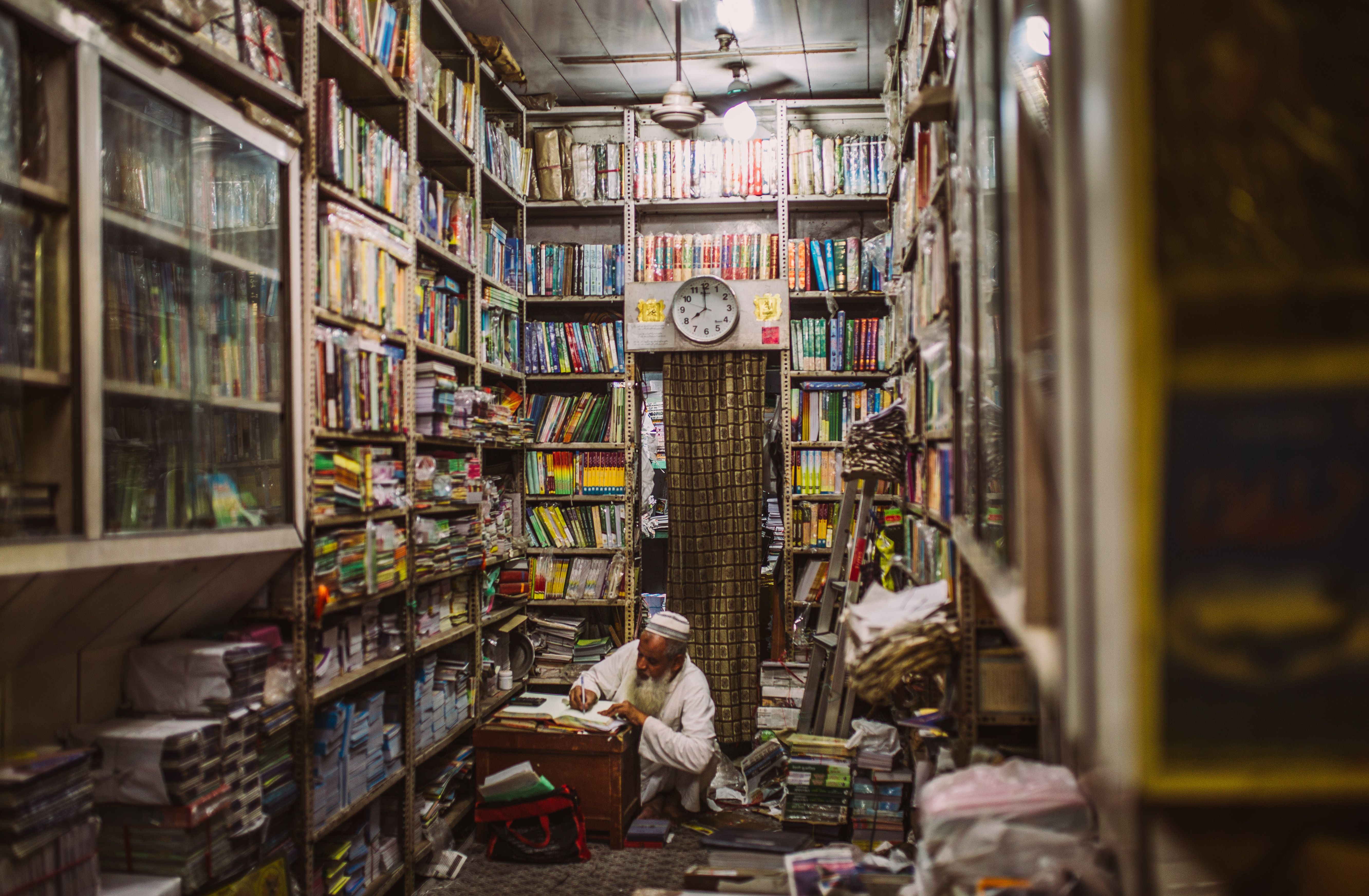 Bookshop and café frontages along the arcade of Khan Market in central Delhi