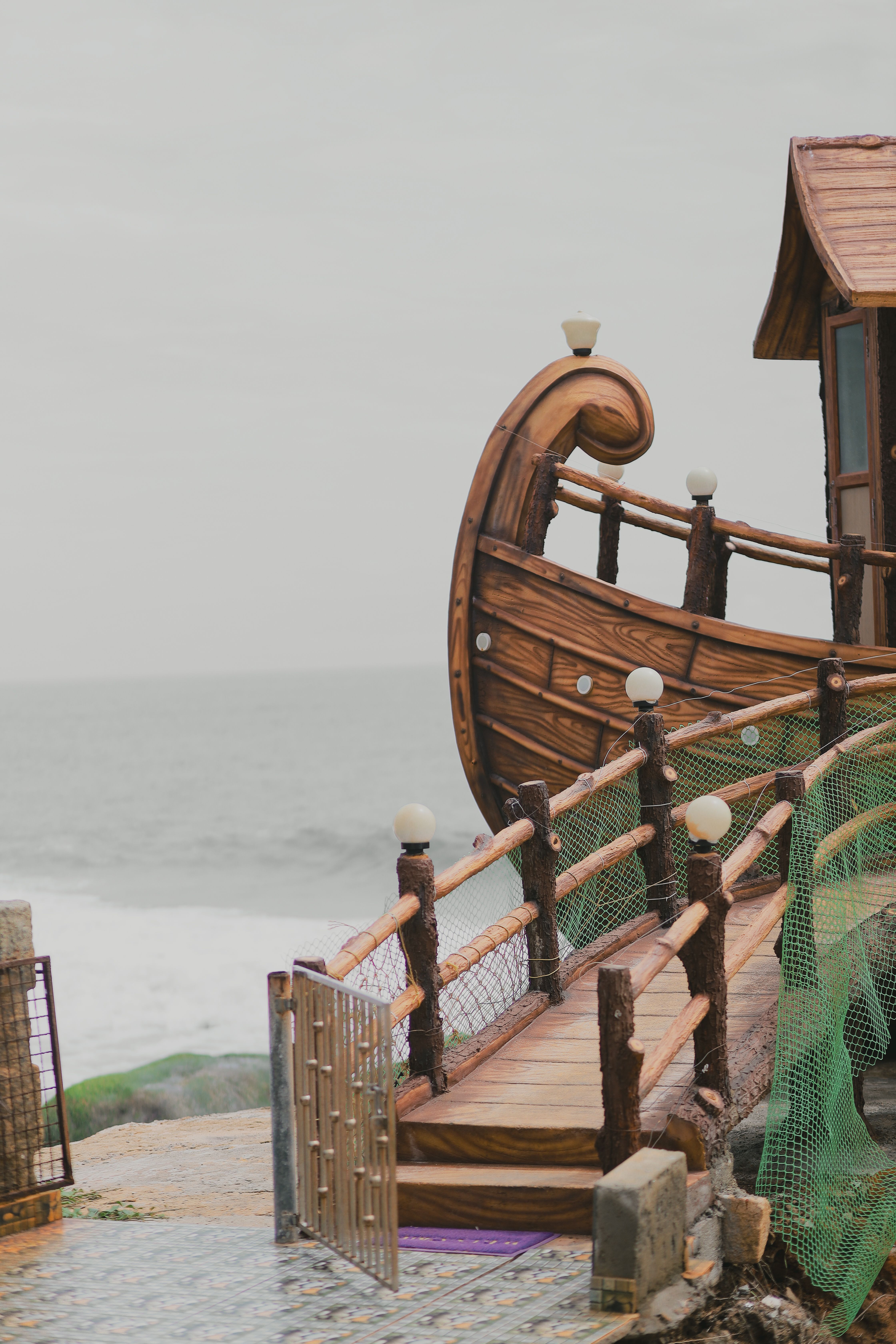 Rustic Boat-Inspired Architecture by the Sea · Free Stock Photo