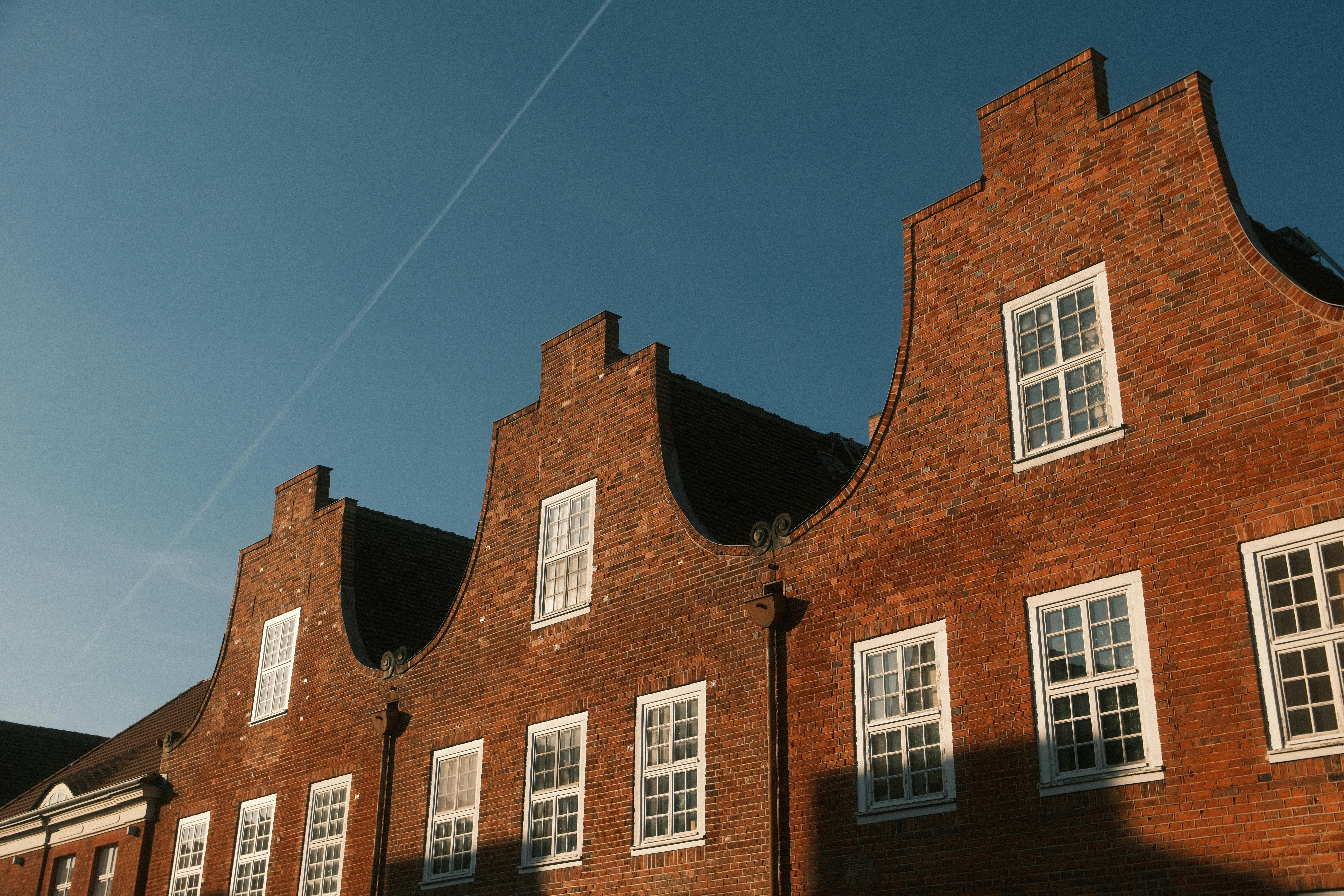 Captivating shot of historical brick buildings in Potsdam, Germany at sunset.