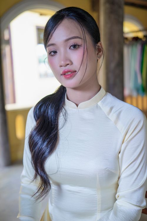 Free Portrait of a young woman in traditional Asian attire in an indoor setting. Stock Photo