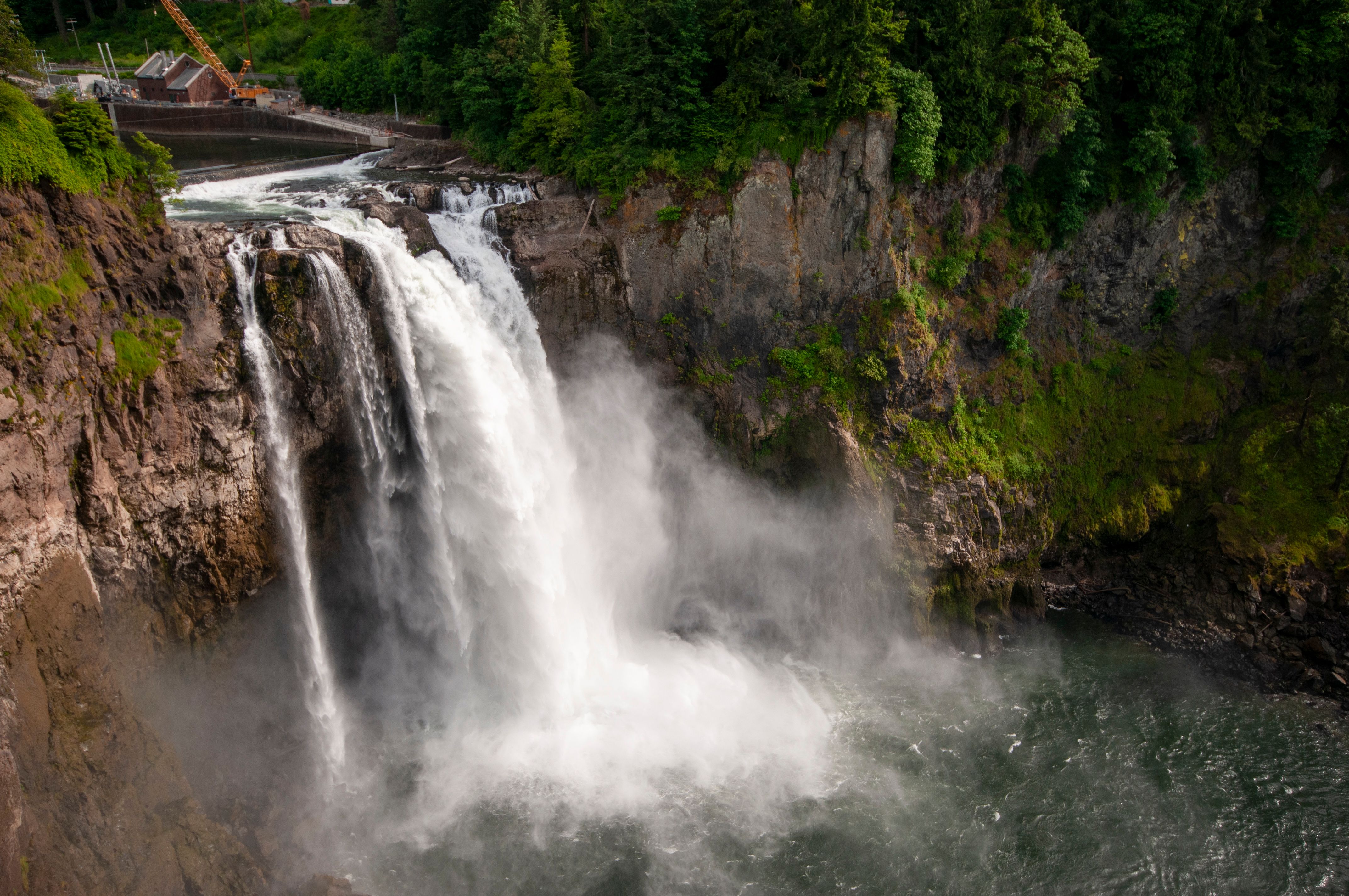 Breathtaking view of Snoqualmie Falls surrounded by lush greenery.