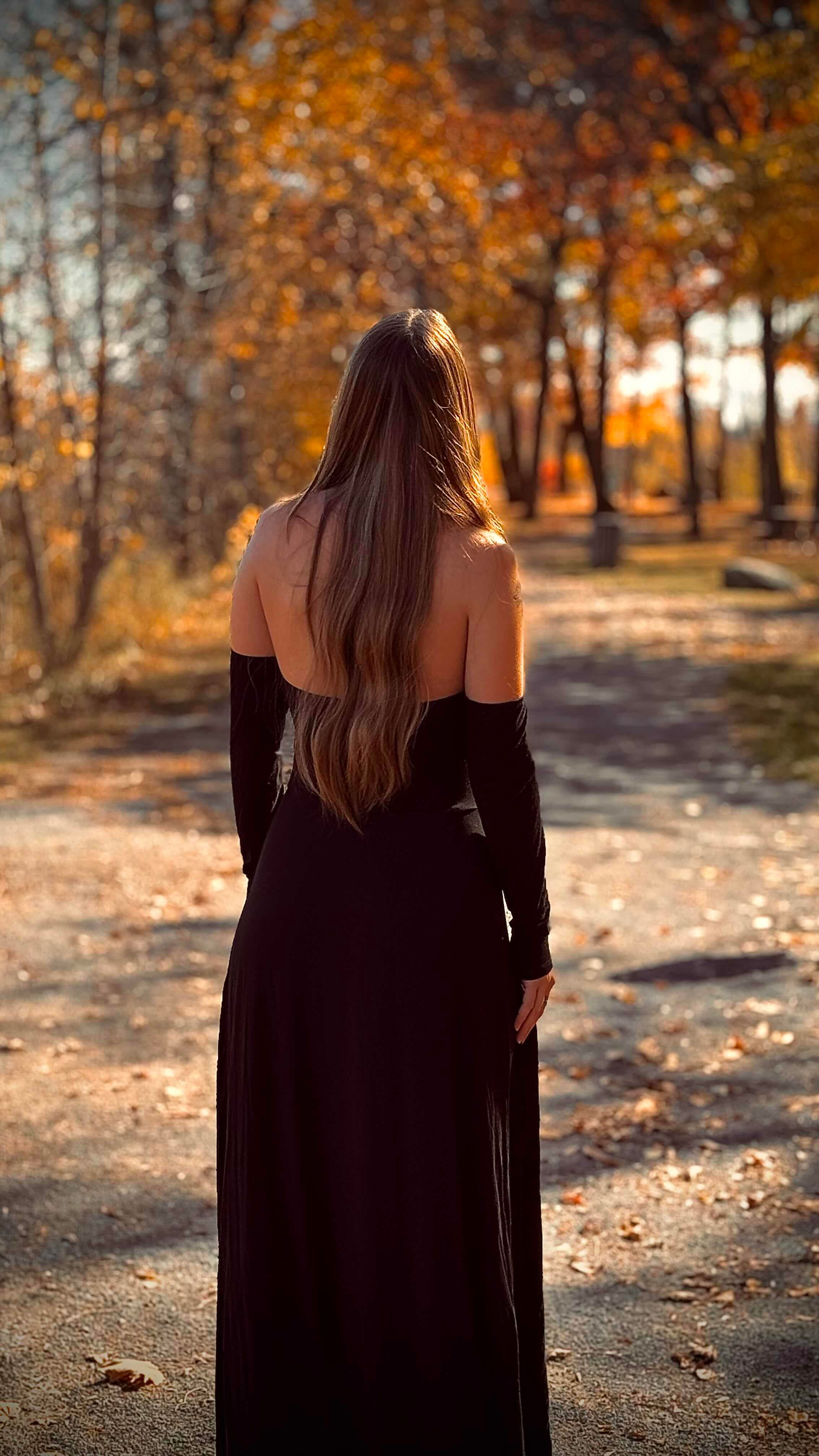 Woman in Black Dress Walking in Autumn Park · Free Stock Photo