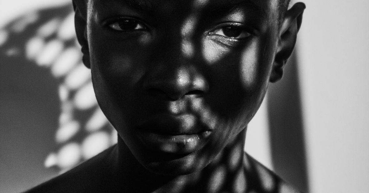 Shadow Potrait Monochrome Portrait with Dramatic Shadow Play · Free Stock Photo