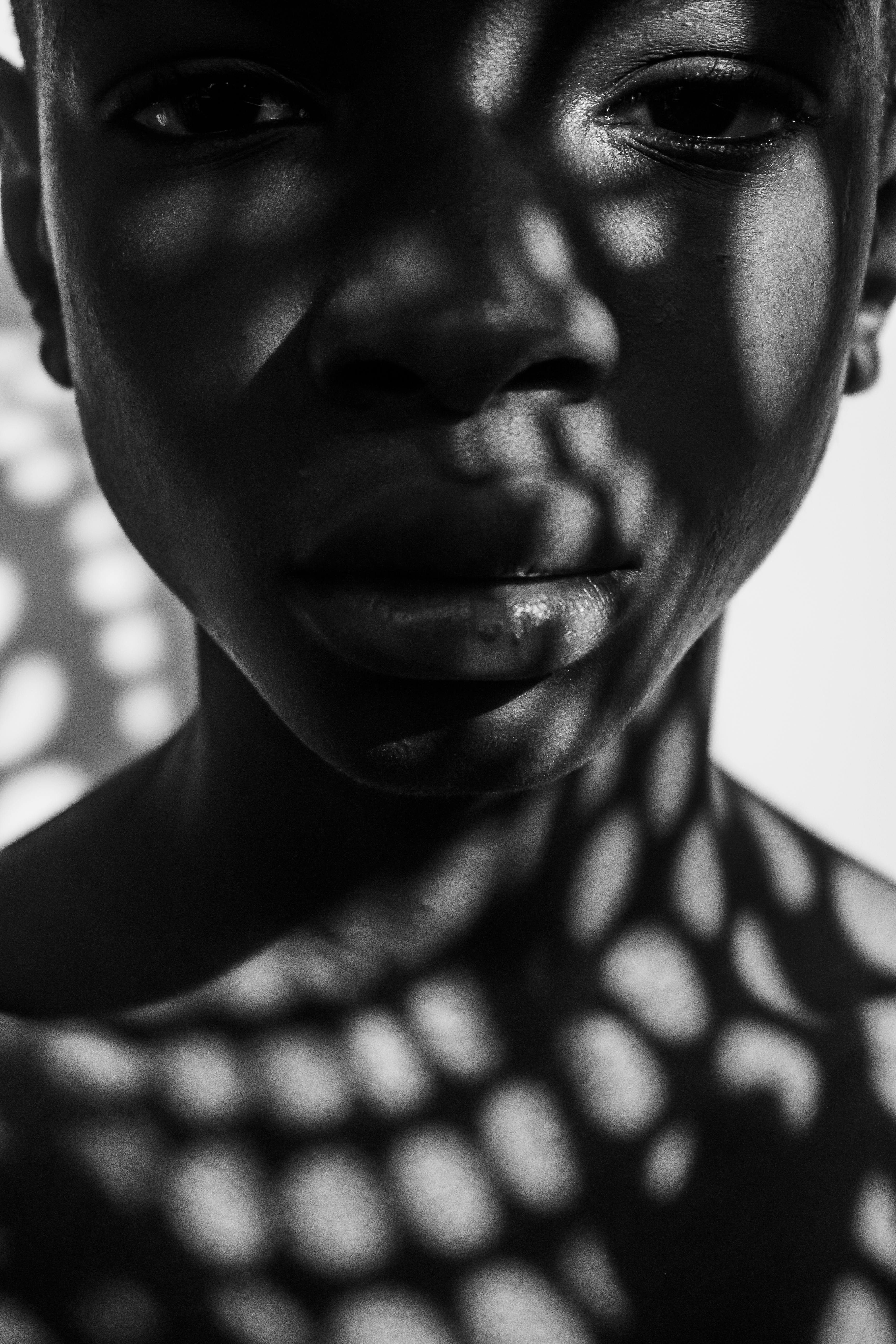 Artistic Portrait with Shadow Patterns · Free Stock Photo