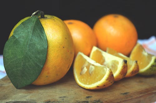 Gratis lagerfoto af appelsiner, appelsinfrugt, blad
