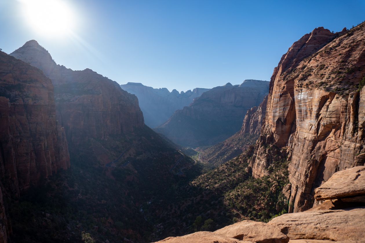 Stunning view of Zion National Park canyon walls under bright sunlight