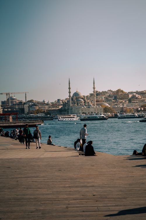 Free A vibrant scene of Istanbul's waterfront featuring the city's iconic skyline and bustling crowd. Stock Photo