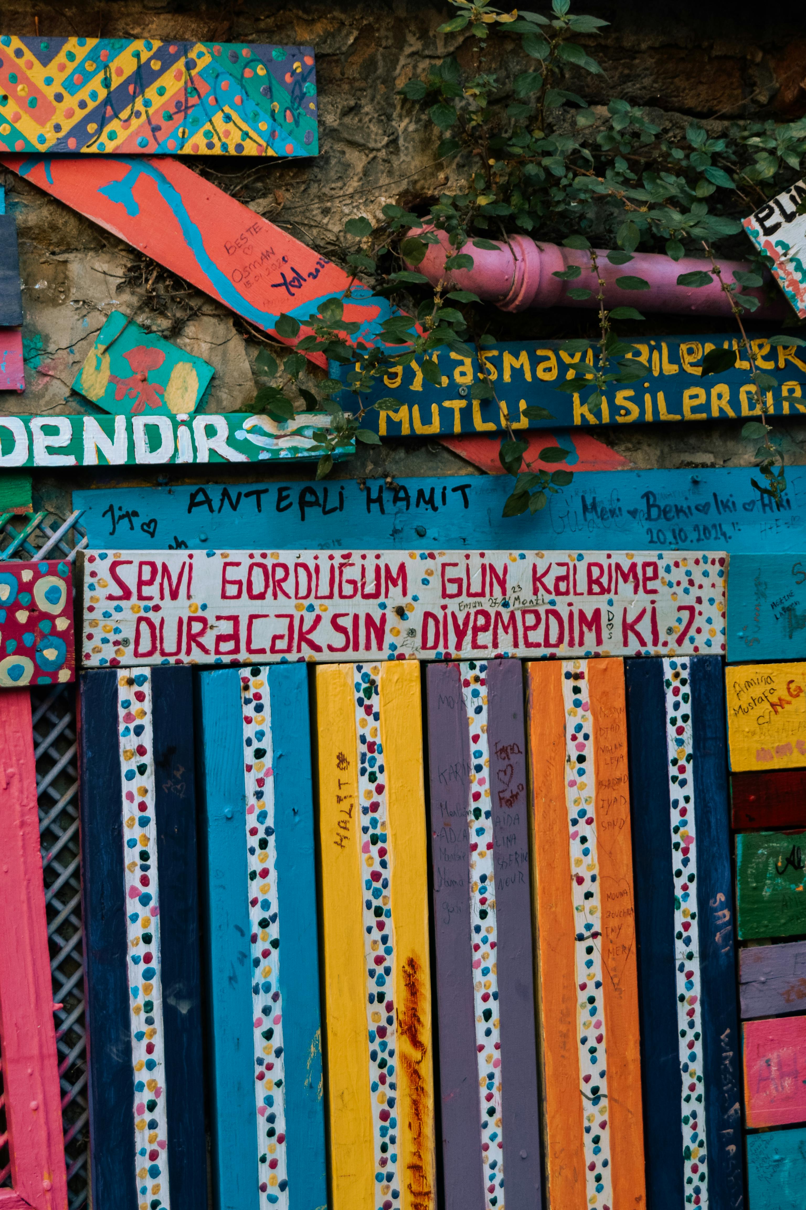 Vibrant wall art featuring inspirational messages and lively colors, creating an artistic urban vibe.