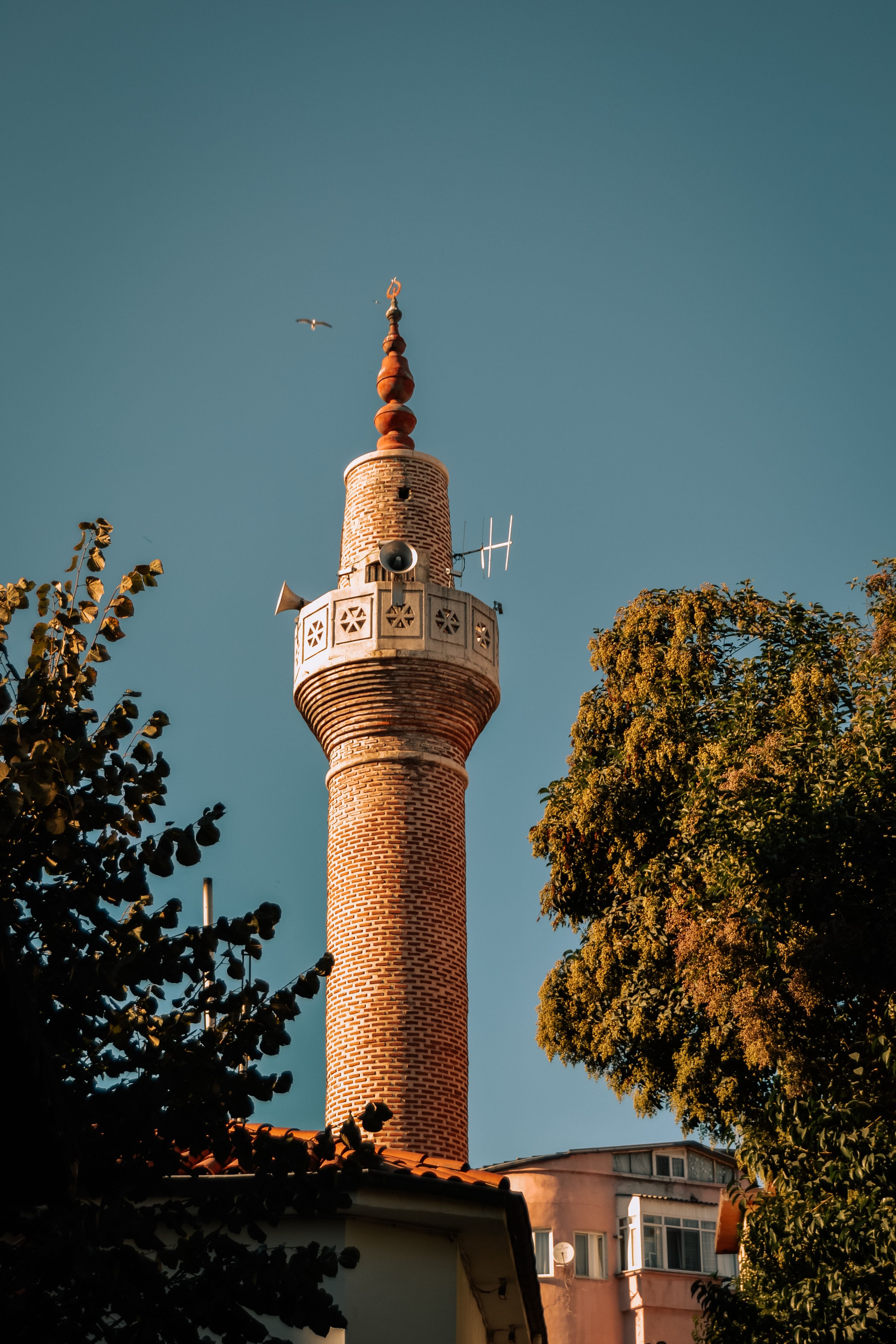 Majestic Brick Minaret Tower under Clear Sky · Free Stock Photo
