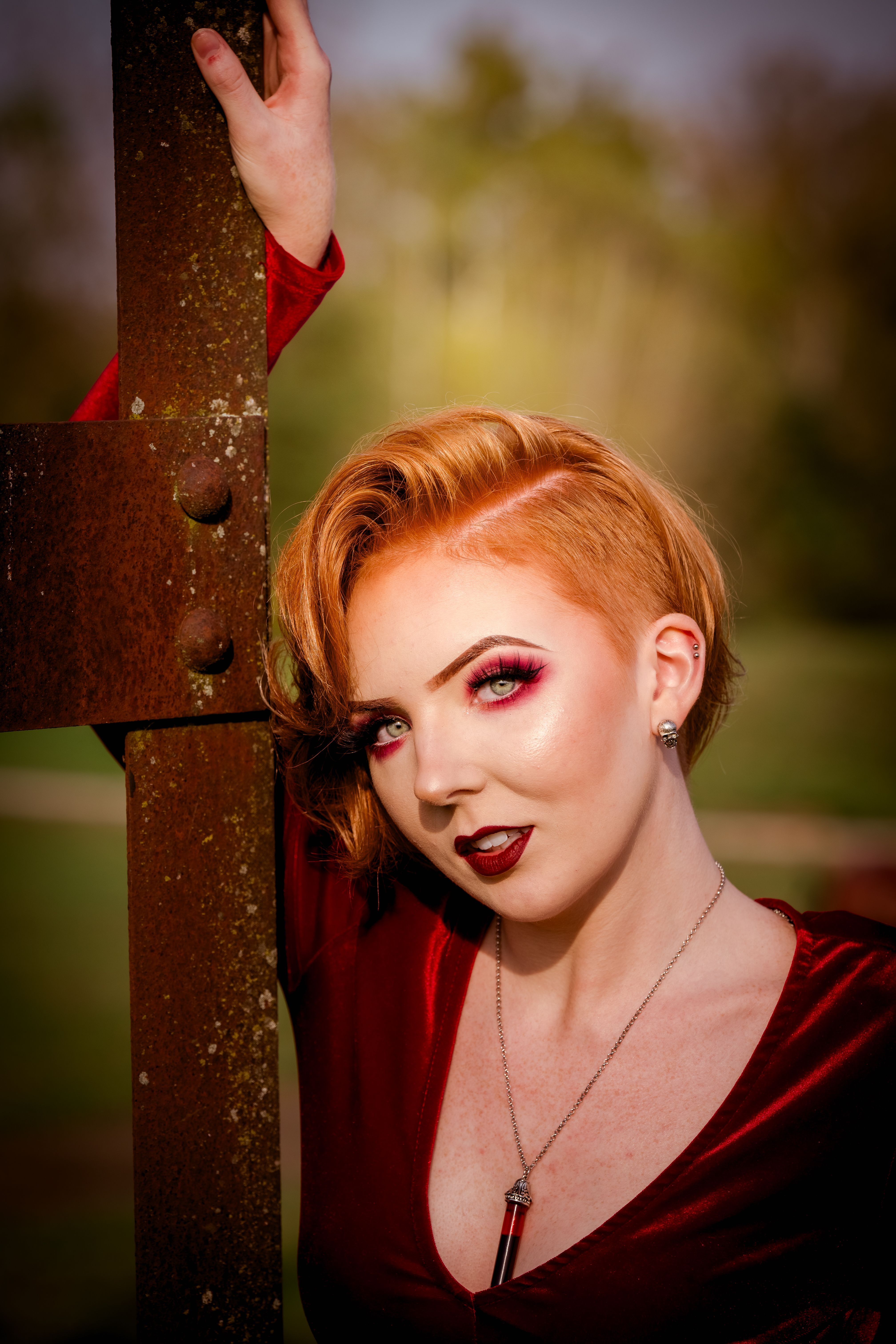 Elegant Woman Posing in Red Velvet Dress Outdoors · Free Stock Photo