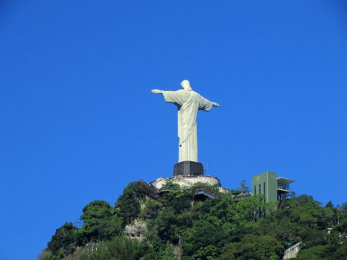 Free A stunning view of Christ the Redeemer statue against a clear blue sky in Rio de Janeiro, Brazil. Stock Photo