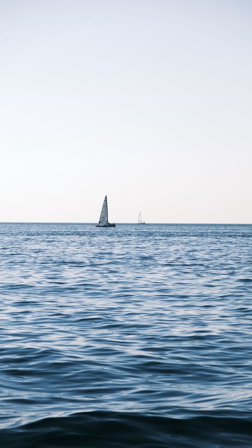 Boats on Body of Water Under Blue Sky · Free Stock Photo