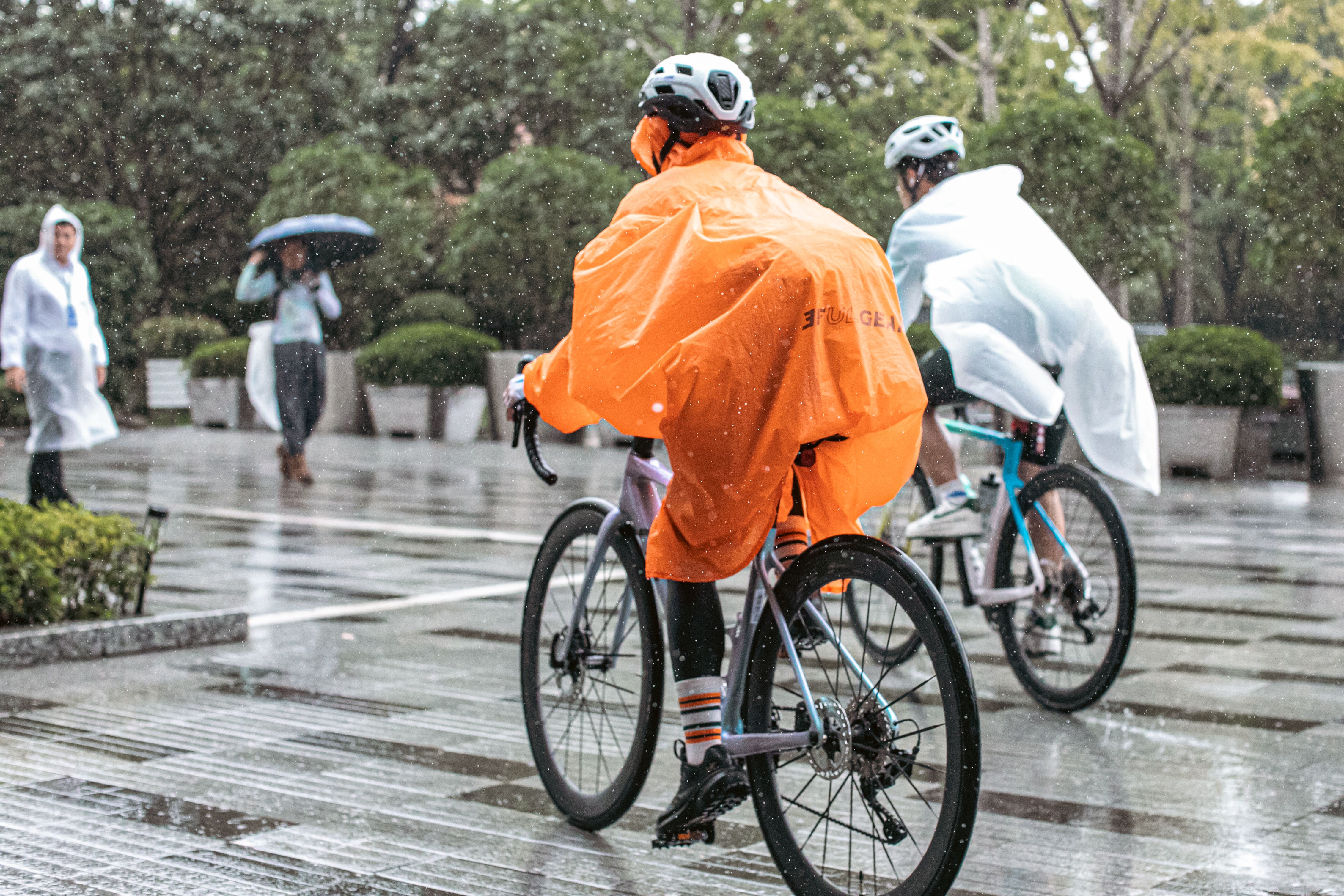 Person in rain poncho at an outdoor event