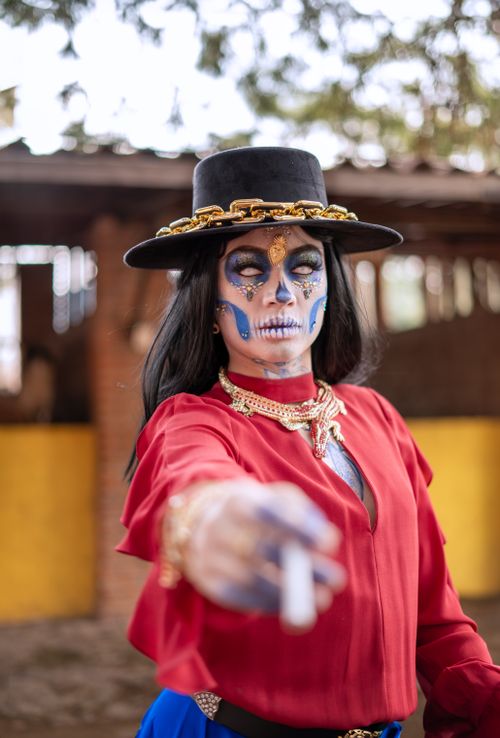 Free Colorful Day of the Dead makeup and costume portrait outdoors in daylight. Stock Photo
