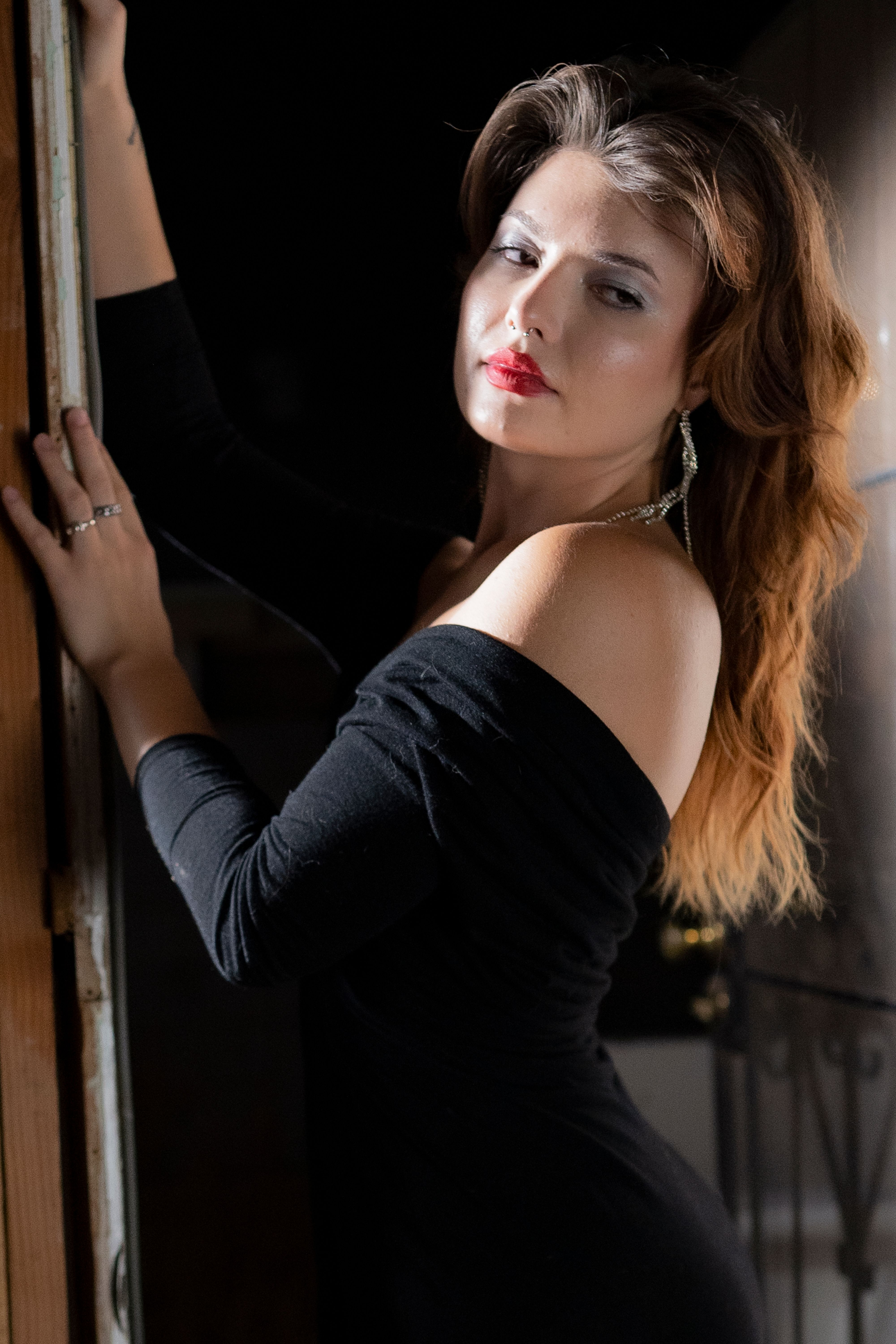 Elegant Portrait of a Stylish Woman in Black Dress · Free Stock Photo