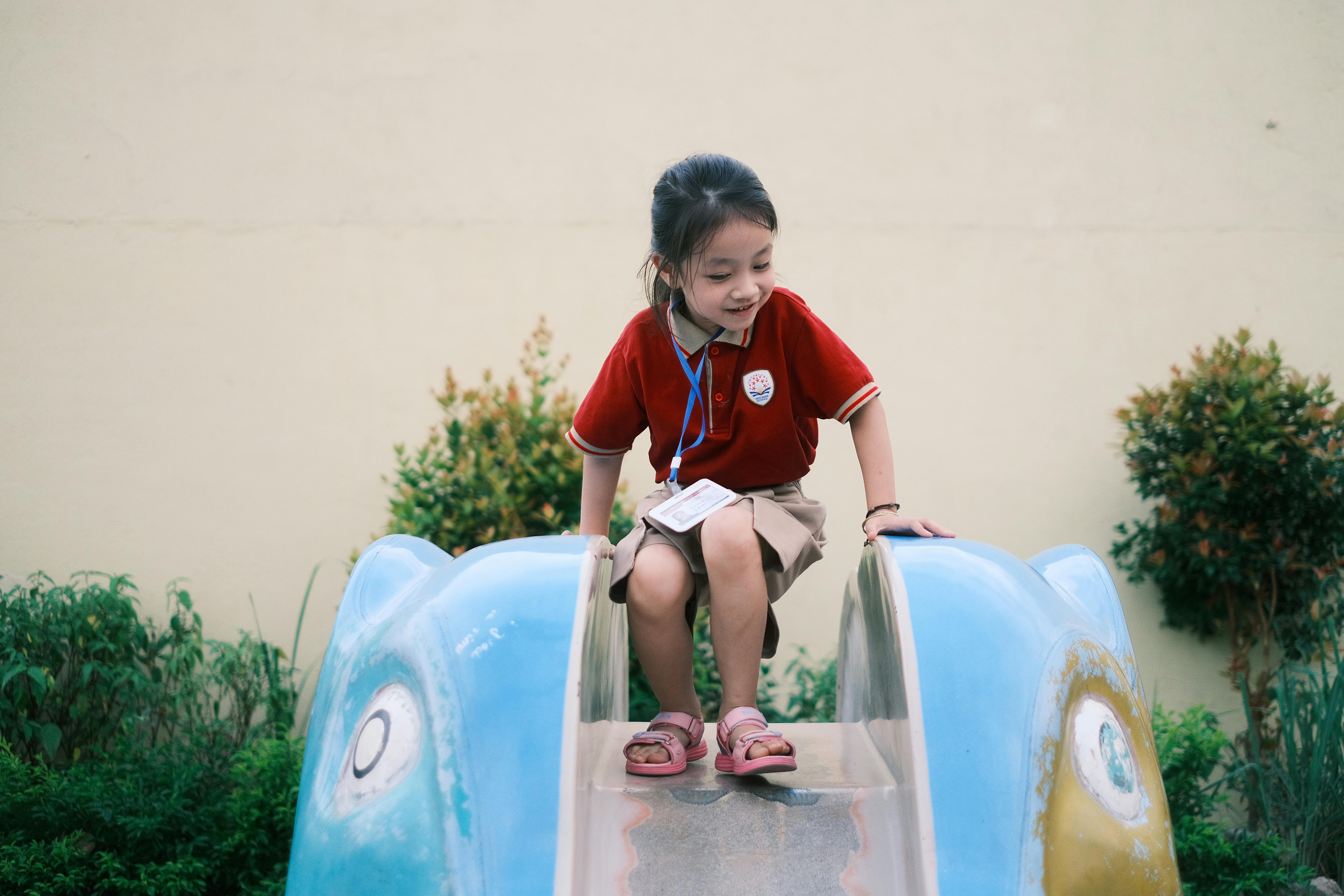Photo of a child playing in an outdoor space