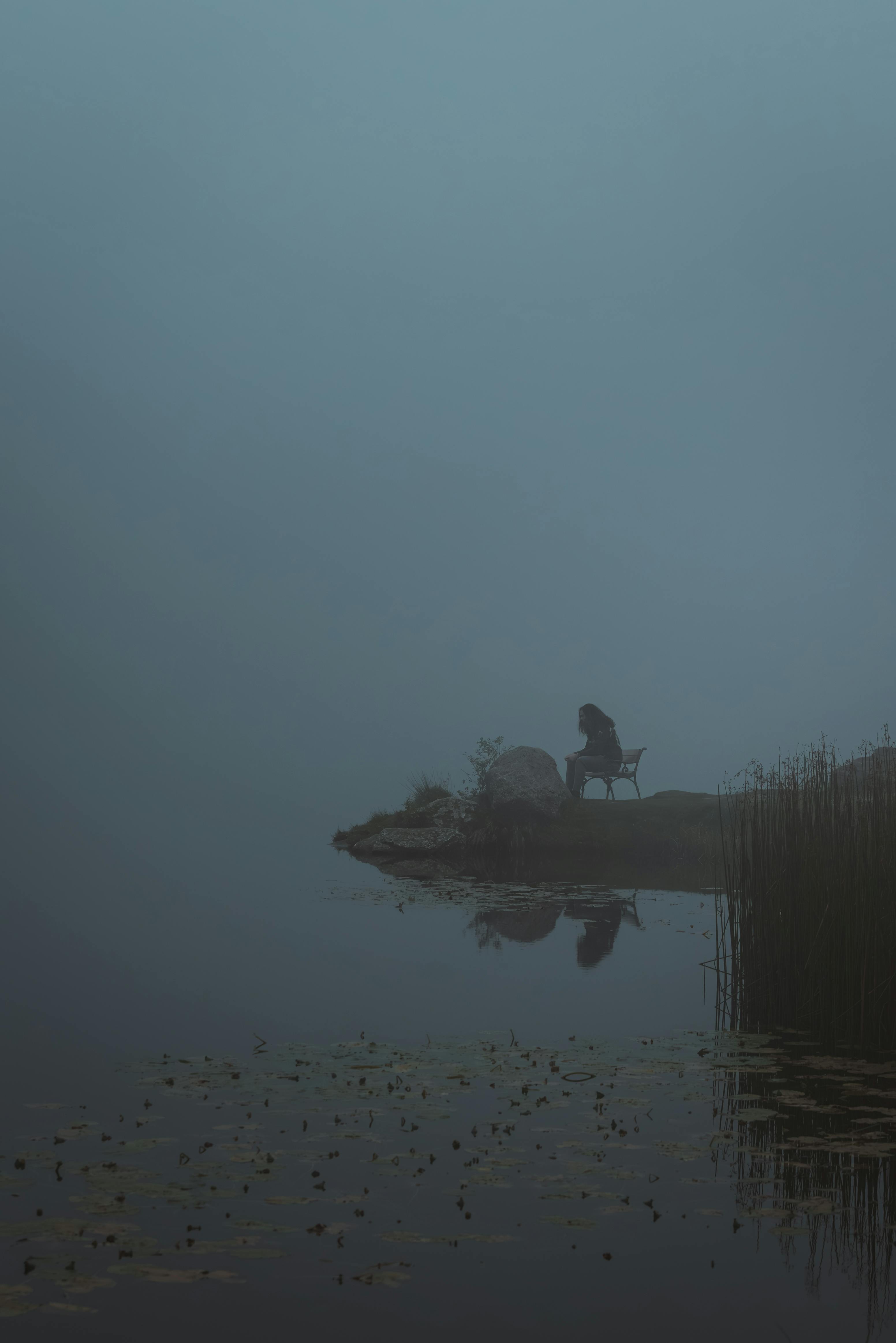 serene reflection by a misty lake in austria