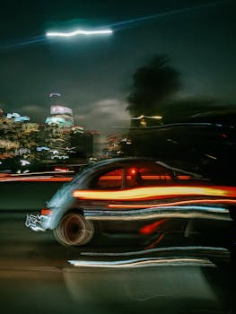 Blurred long exposure of Los Angeles car and city lights at night, showcasing dynamic urban energy.