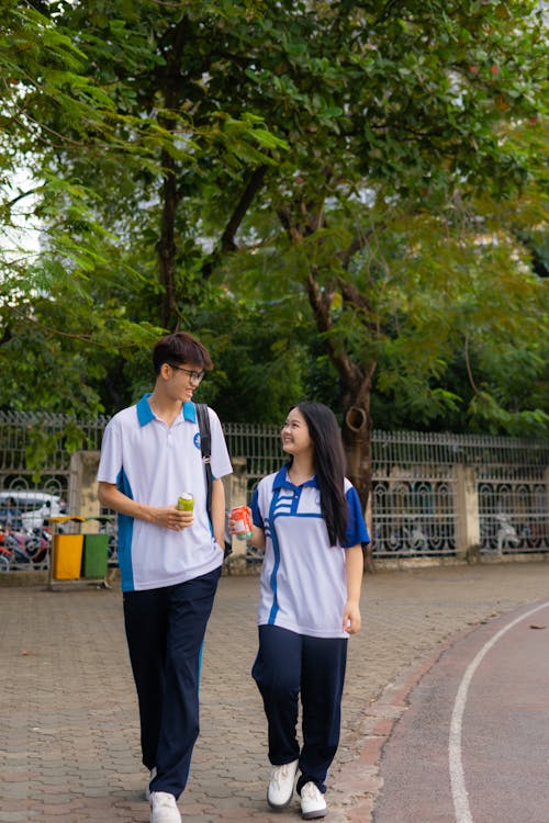 Students Strolling on Campus Outdoors · Free Stock Photo