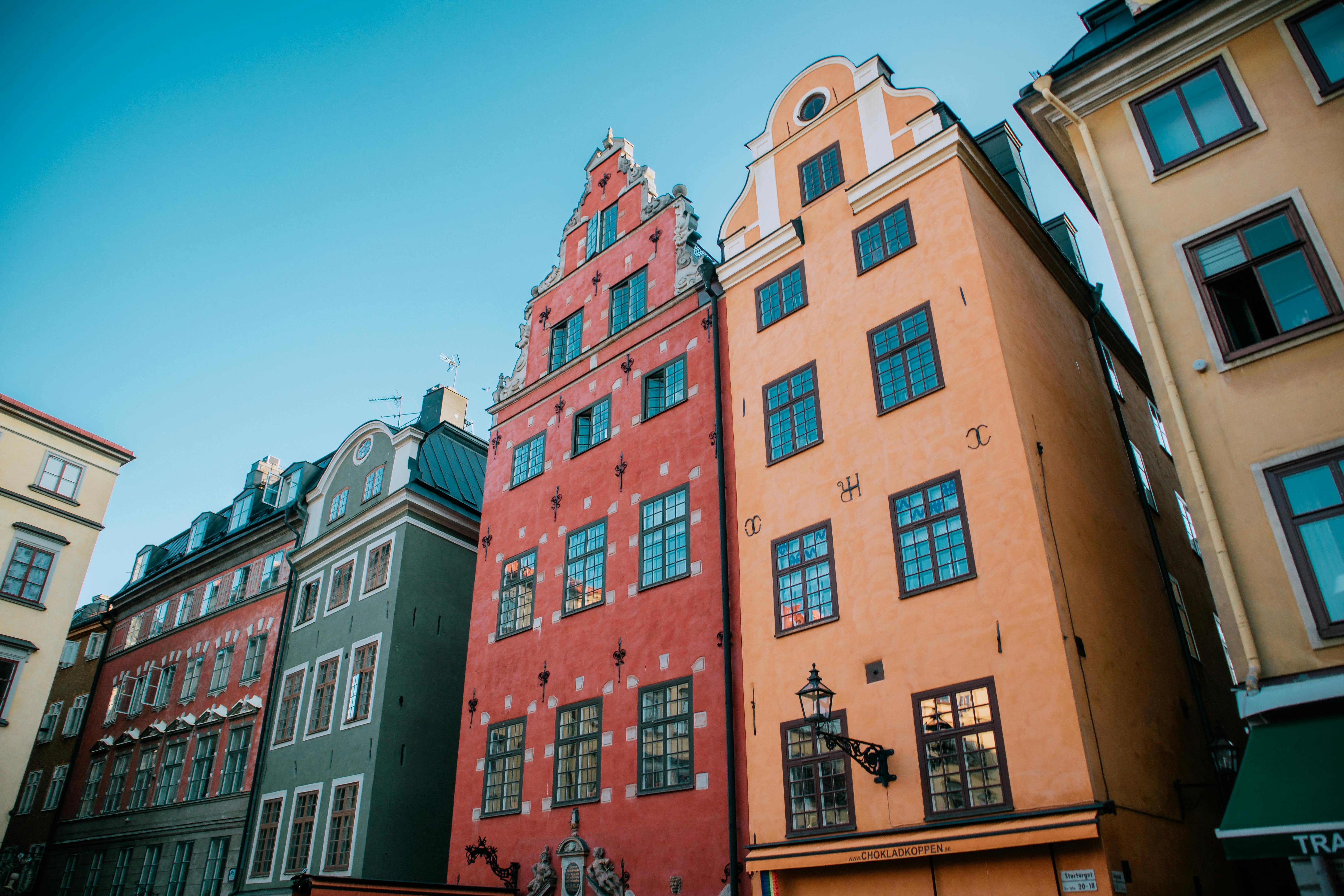 Vibrant and iconic buildings in Stockholm's historical Gamla Stan area.