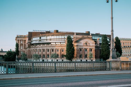 Free Scenic view of the Swedish Parliament building in Stockholm by the waterfront. Stock Photo
