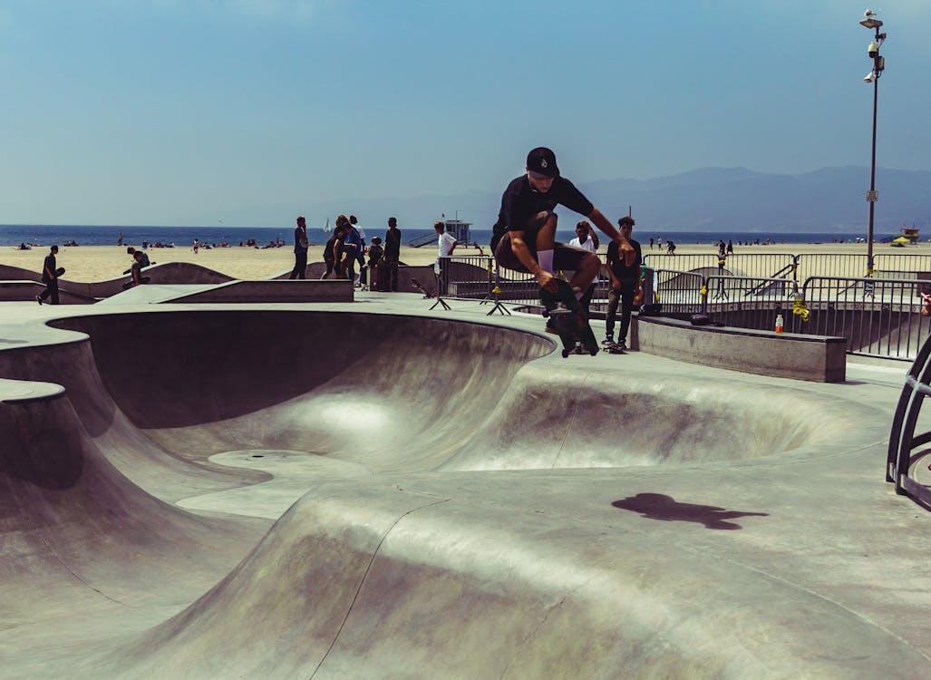 Man Wearing Black Shirt Skateboarding