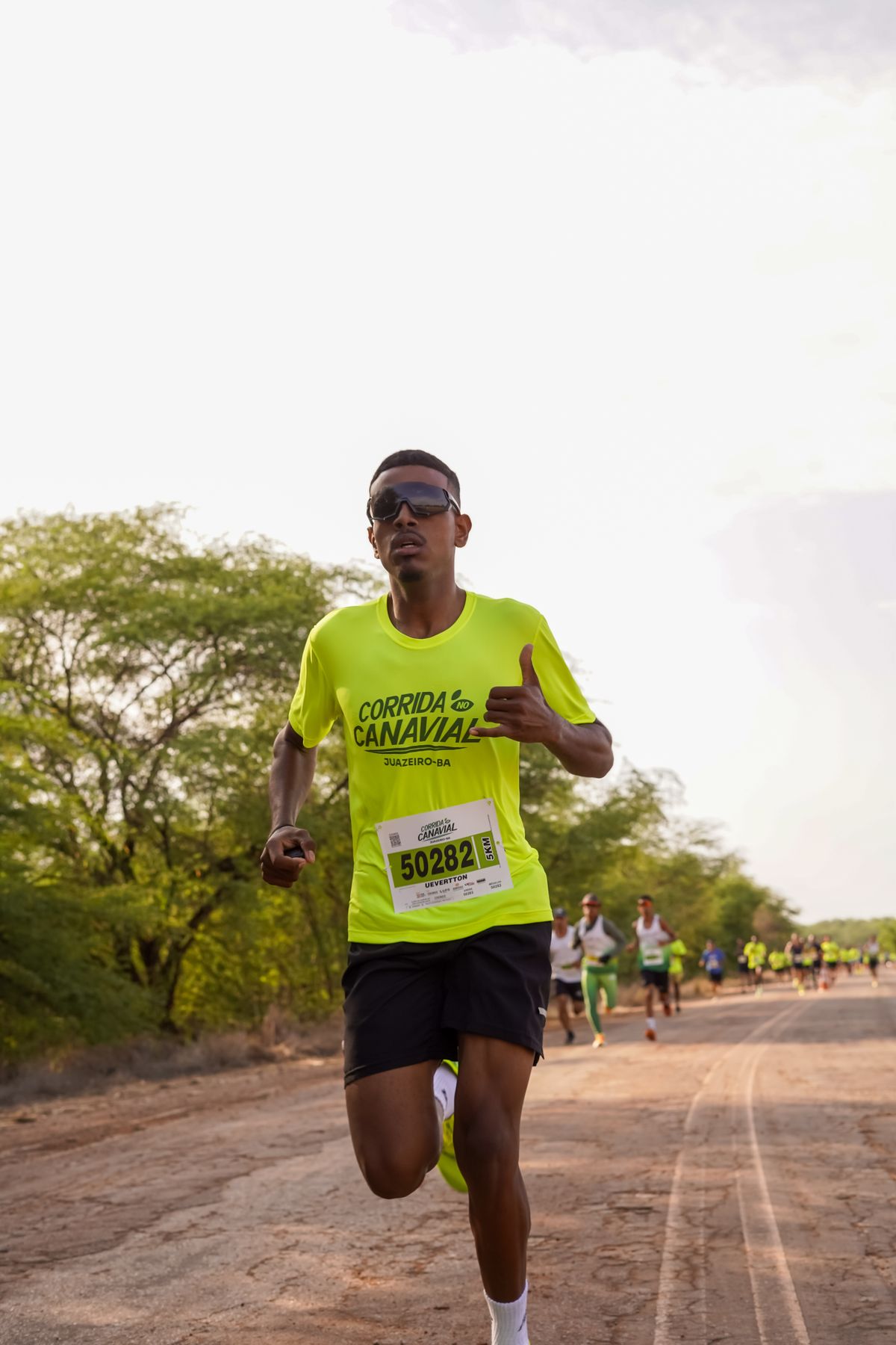 Outdoor runner wearing modern performance sportswear during a road race