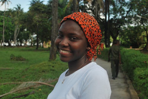 Smiling Woman Wearing a Floral Headscarf