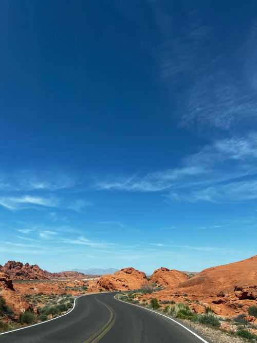 Free Stunning view of a winding road through the Moapa Valley desert landscape in Nevada. Stock Photo