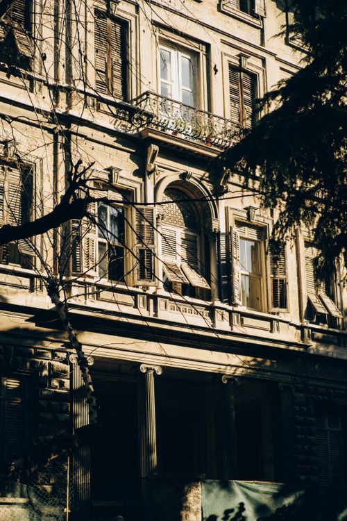 Free Sunlit view of a historic building facade in Istanbul, showcasing elegant architecture. Stock Photo