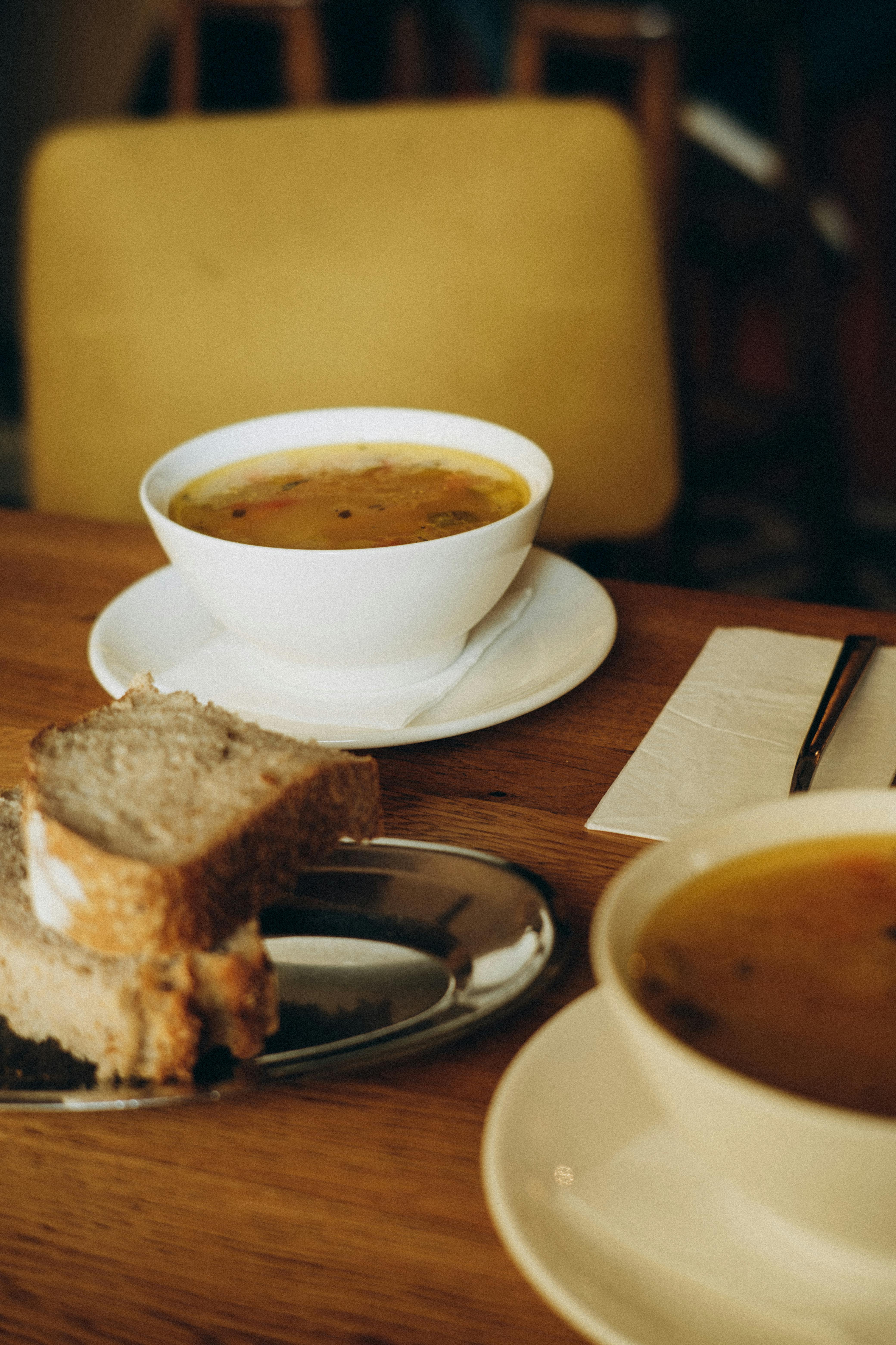 Warm soup and bread setting in a cozy İstanbul café.