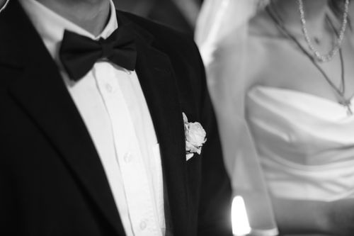 Free Close-up of bride and groom in wedding attire, highlighting elegance and timeless style. Stock Photo