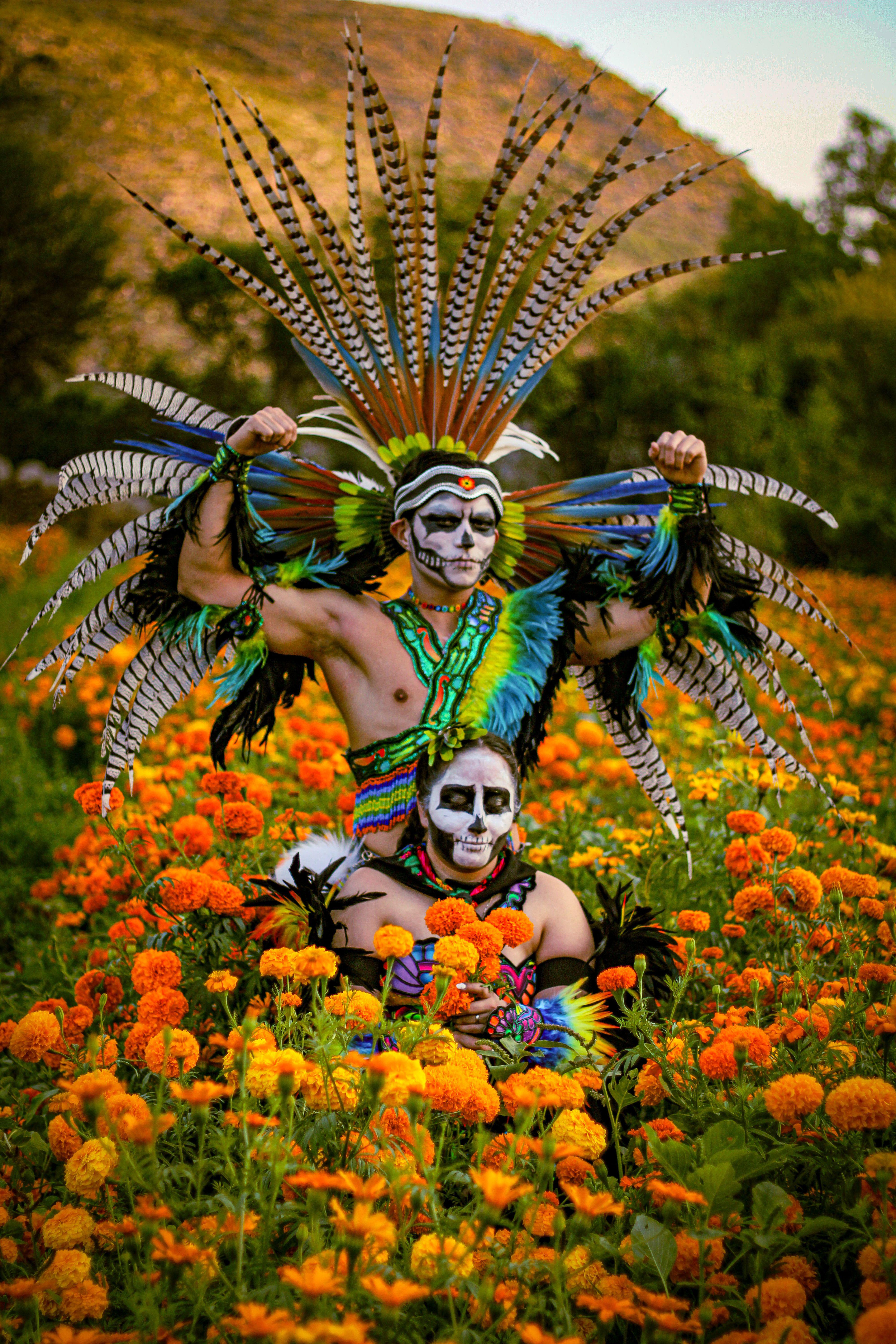 Vibrant Dia de los Muertos Costumes in Field · Free Stock Photo