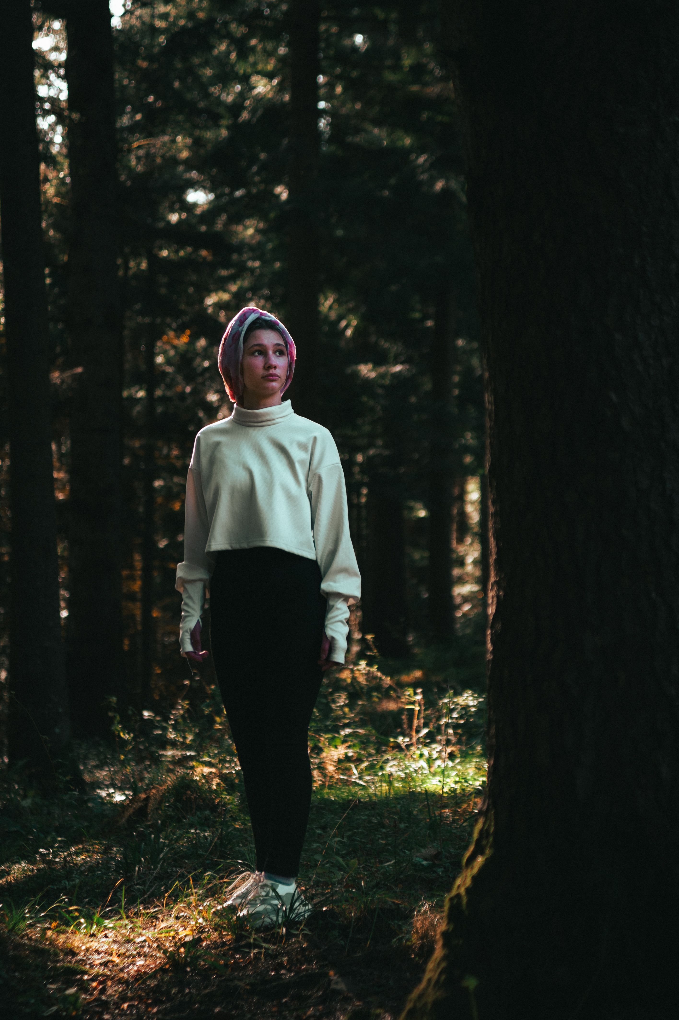 Young Woman in a Dark Enchanted Forest · Free Stock Photo