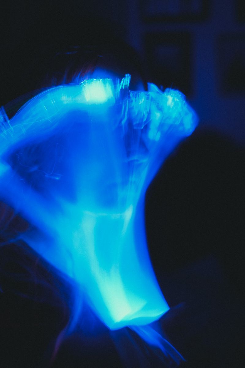 Abstract Blue Light Swirl on Black Background · Free Stock Photo