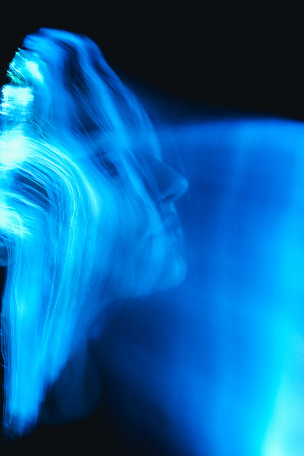 Abstract Blue Light Long Exposure Portrait · Free Stock Photo