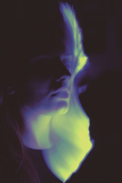 Surreal portrait with a neon glow effect — photo by Diana on Pexels